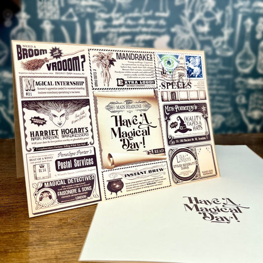 Have a Magical Day’ greeting card displayed in a magical shop setting for witches and wizards