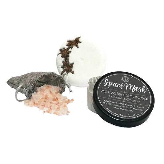 Pamper set featuring a face mask, bath salts, and a bath fizzer, arranged for a luxurious and relaxing spa experience