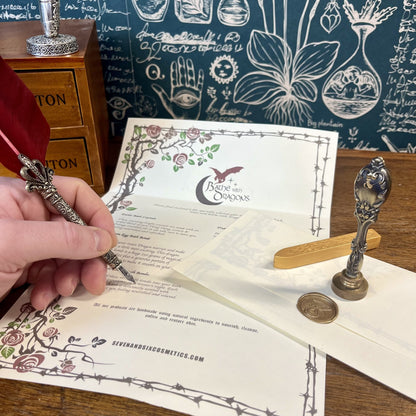 Fantasy dragon scroll with gold wax-sealed stamp, part of the dragon egg bath bomb gift set, styled like a mystical message from a dragon’s kingdom