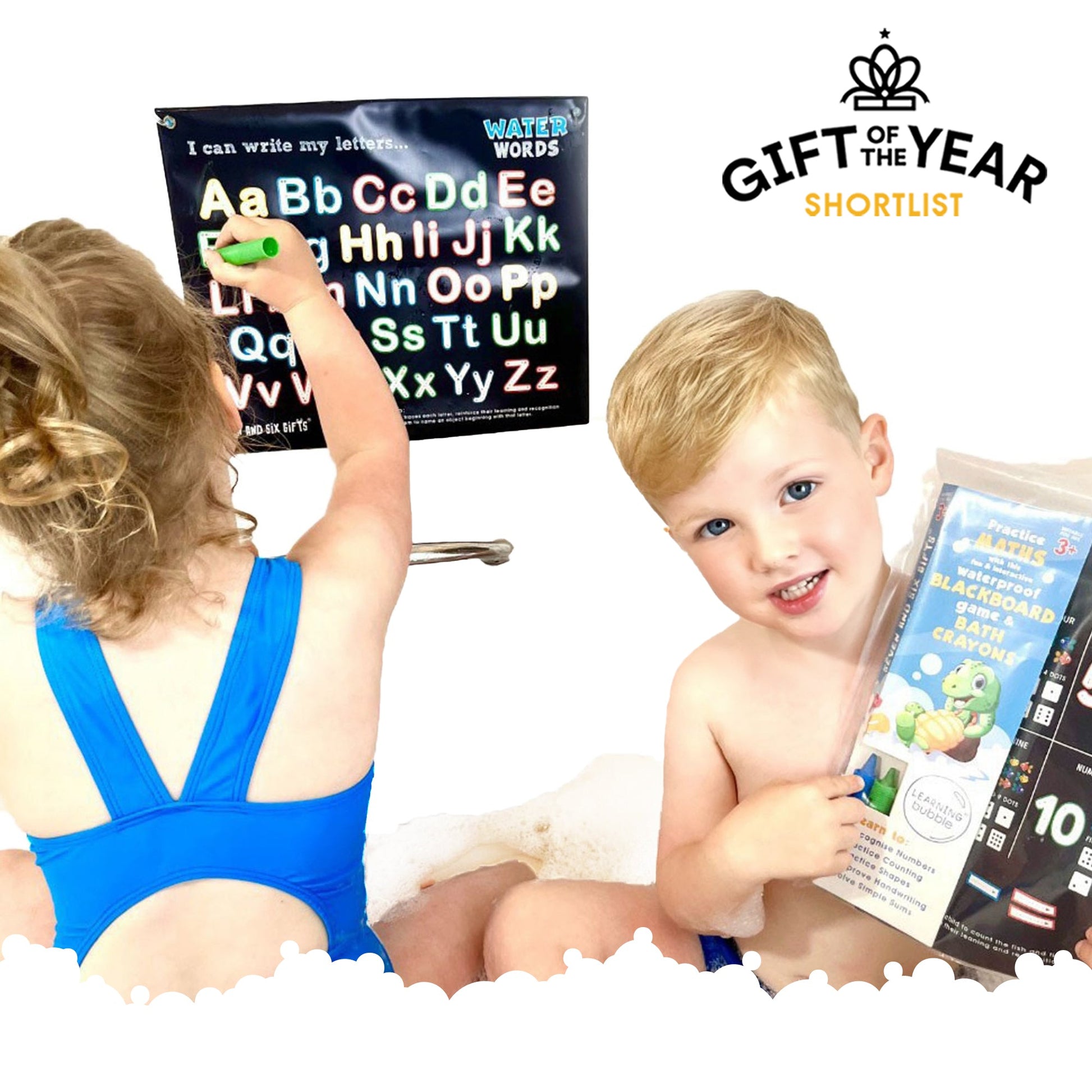 Children practising number tracing with a waterproof practice board, educational flashcards, and bath crayons, shortlisted for Gift of the Year.