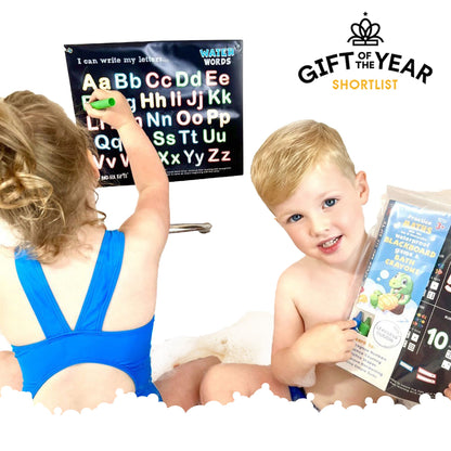 Children practising number tracing with a waterproof practice board, educational flashcards, and bath crayons, shortlisted for Gift of the Year.