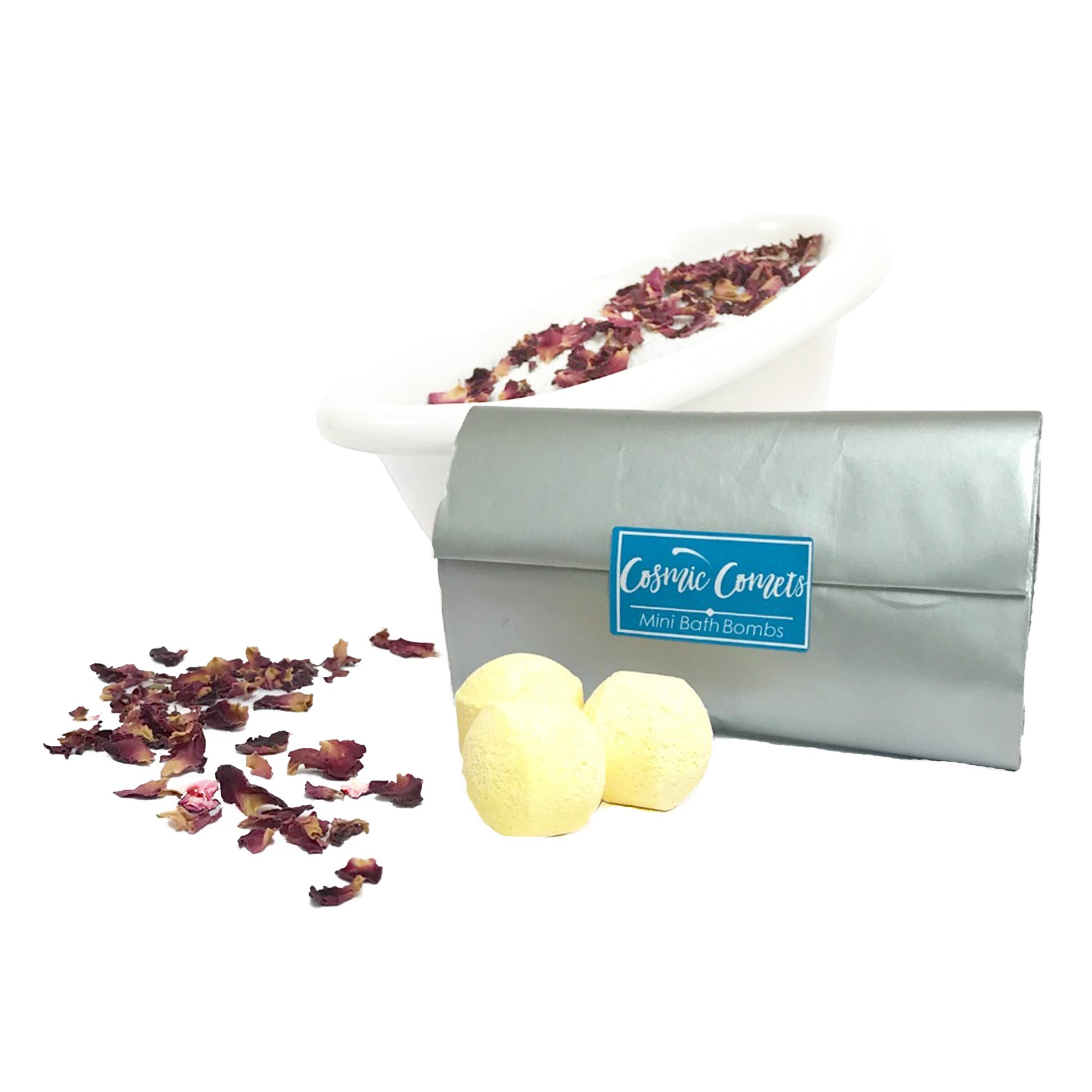 Star sign mini bath bombs dissolving in a bath with rose petals, creating a colorful and relaxing spa experience