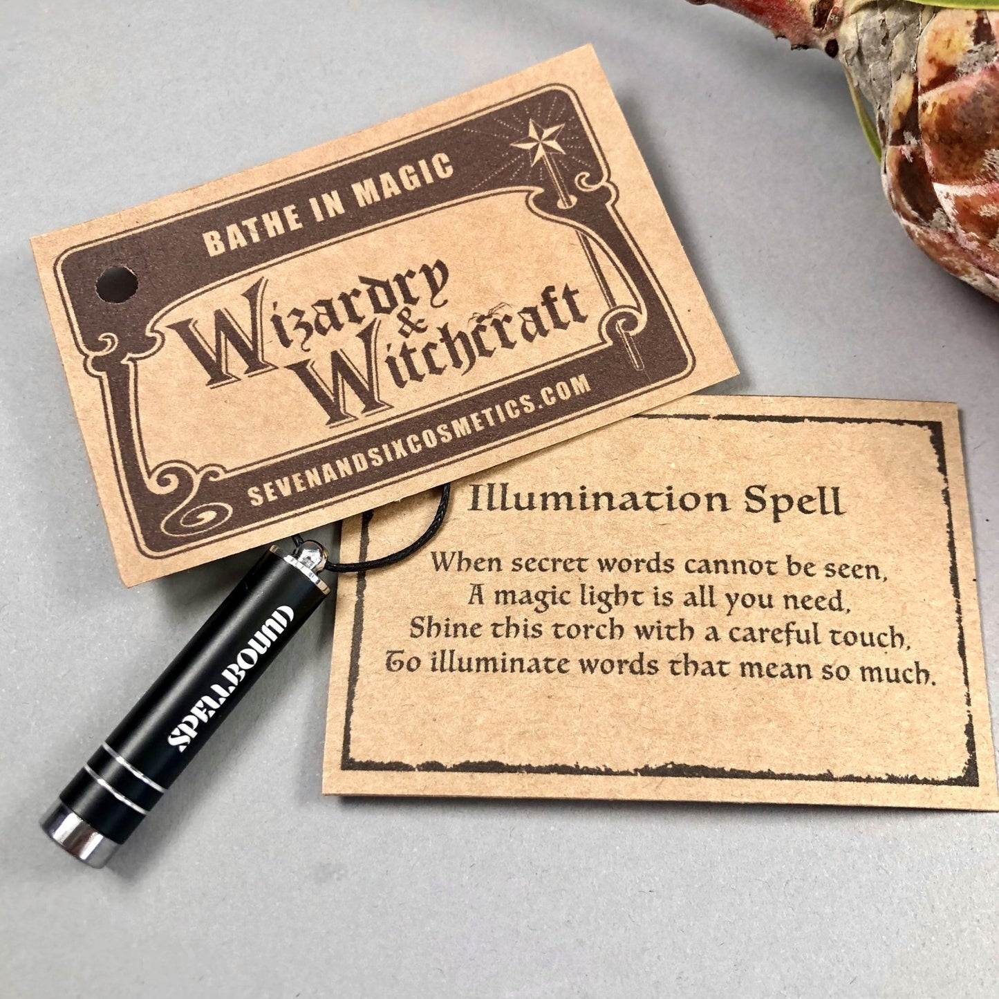 Wizard school magical spell card featuring an illumination spell and a wand, part of a witches and wizards gift set.